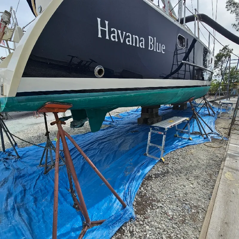 Boat hull with a smooth, glossy finish after Boat Guys paint and fiberglass work
