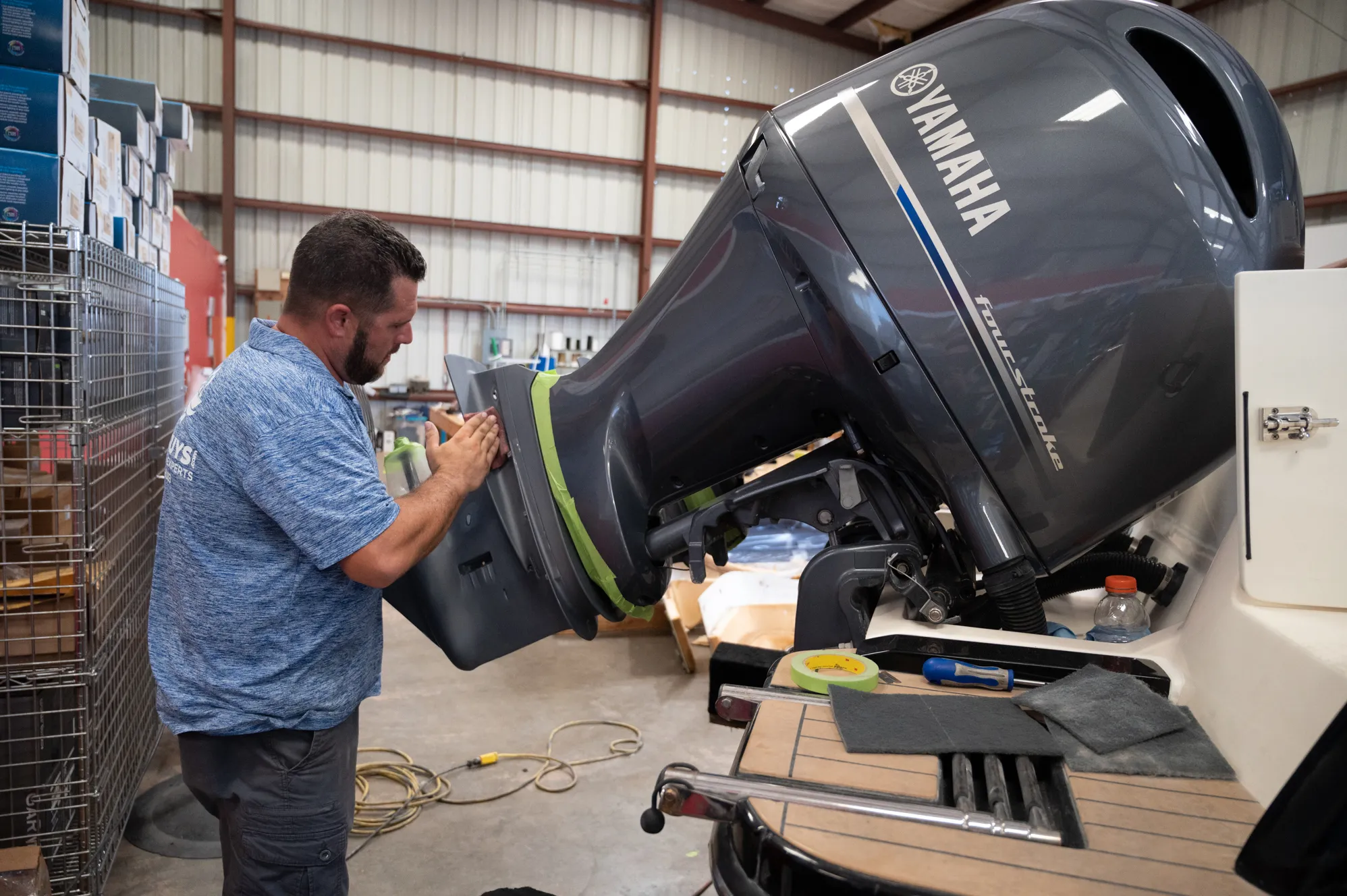 Boat Guys technician servicing a Yamaha four-stroke outboard
