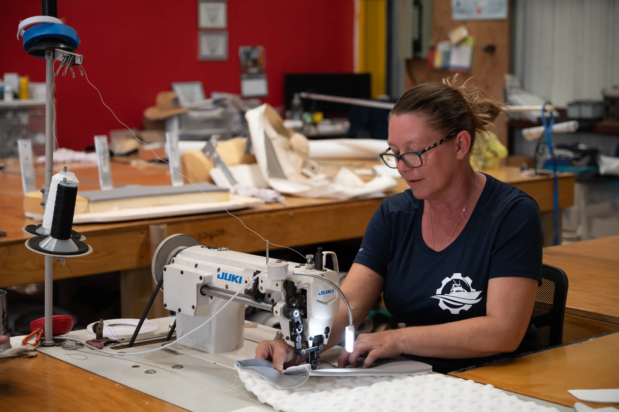 Sewing marine upholstery on a Juki machine in the shop