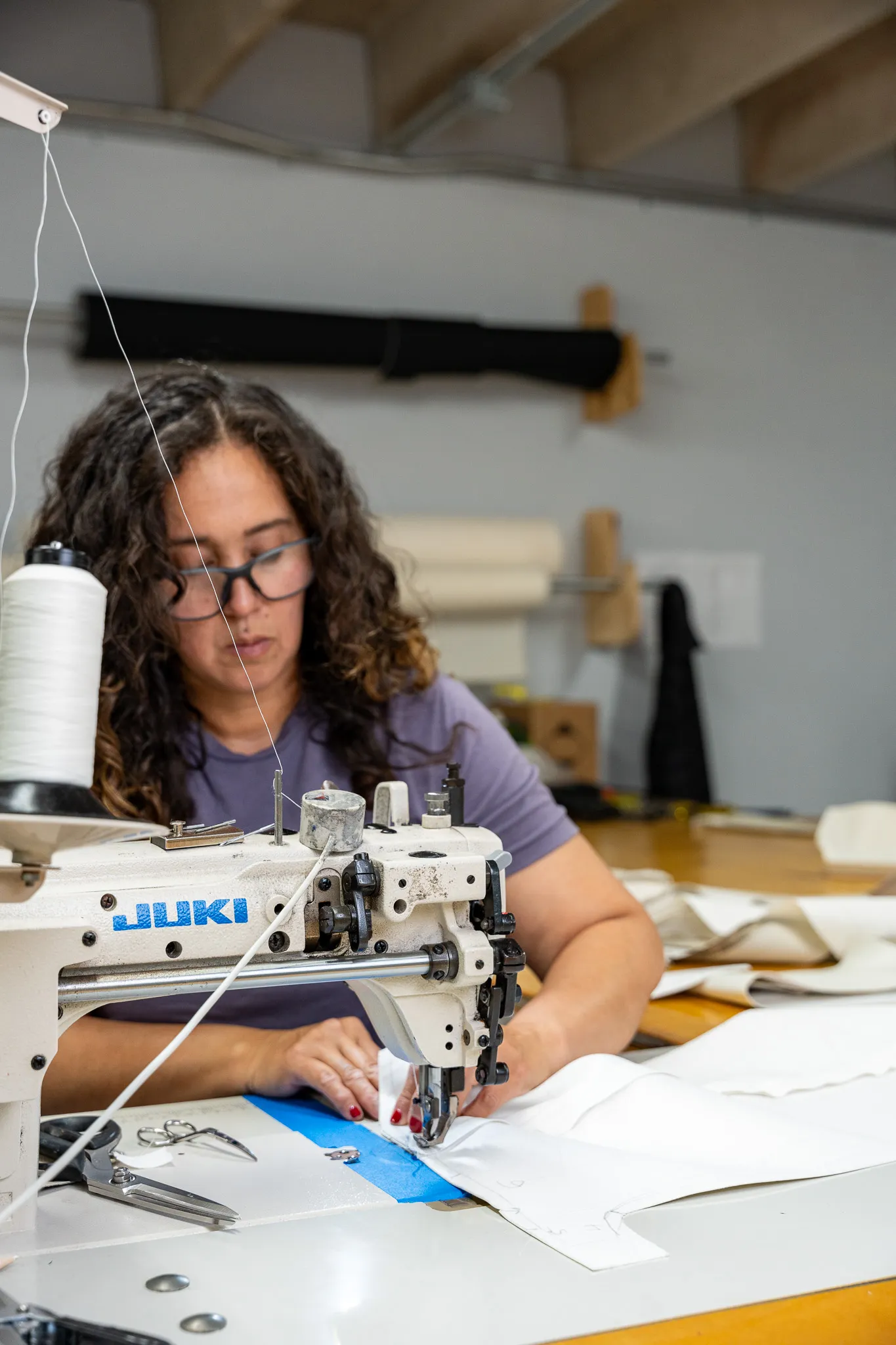 Boat Guys canvas maker sewing marine canvas on an industrial Juki machine