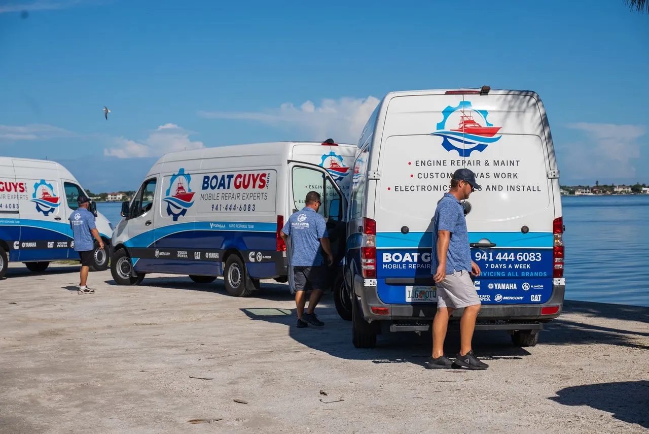 The Boat Guys mobile repair fleet parked by the water in Sarasota