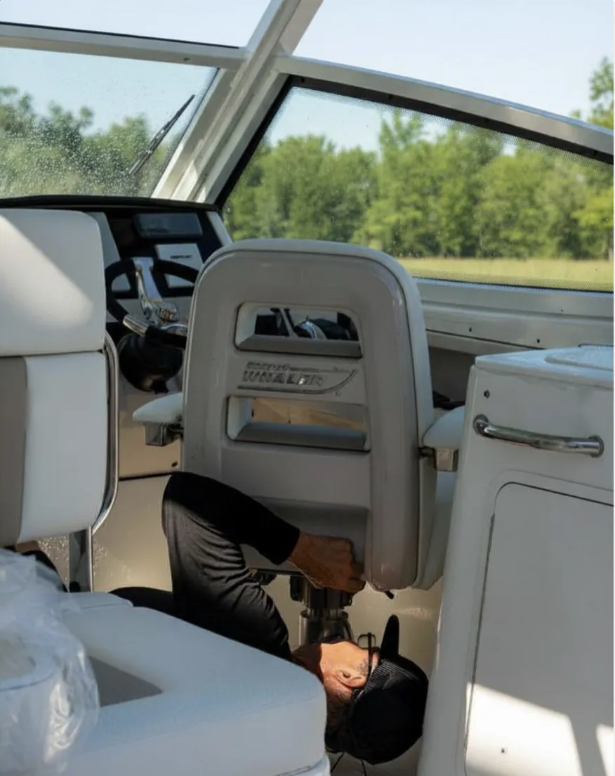 Servicing a helm seat pedestal aboard a Boston Whaler