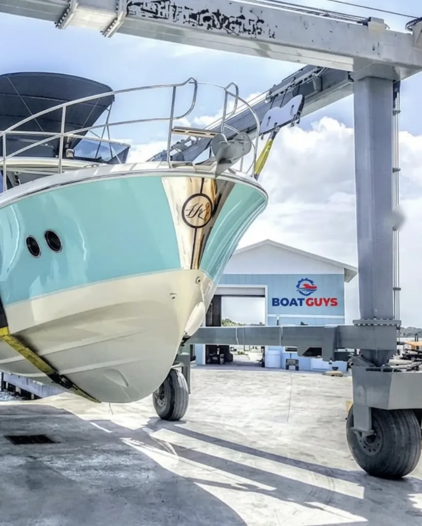 Freshly serviced yacht on the travel lift at the Boat Guys marina